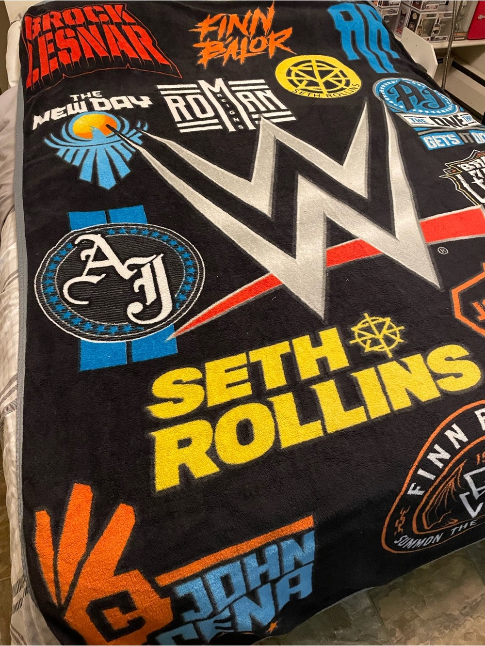 WWE Black Fleece Throw Blanket with Yellow and Blue Graphics